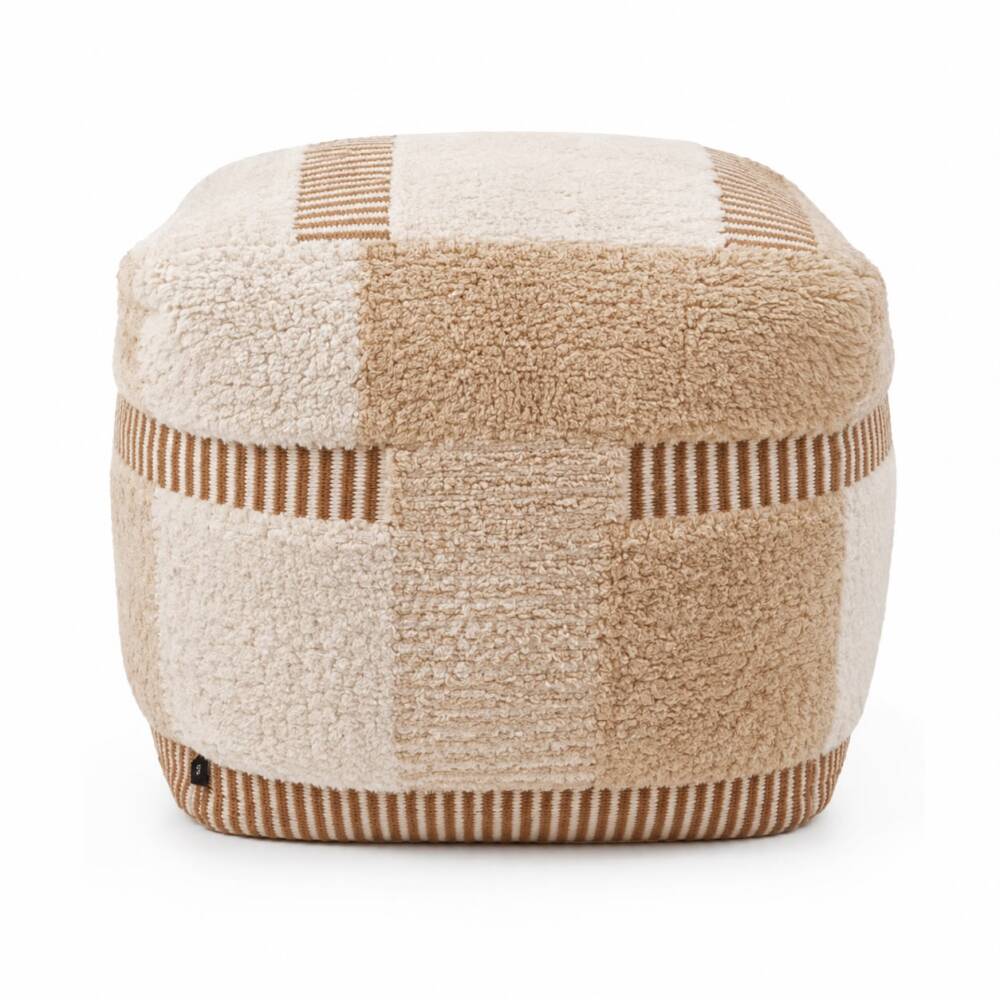 A square pouf with a cream and camel checkerboard textured pattern and ribbed line accents, centered on a bright white background.