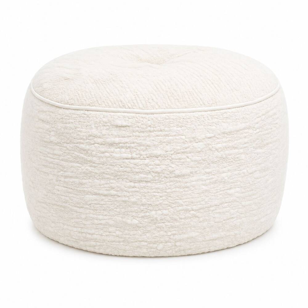 A round, cream-colored upholstered bouclé pouf with subtle piping trim, centered on a bright white background.